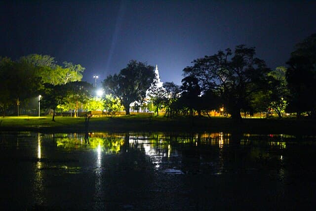 Thuparamaya stupa reflected in water at night