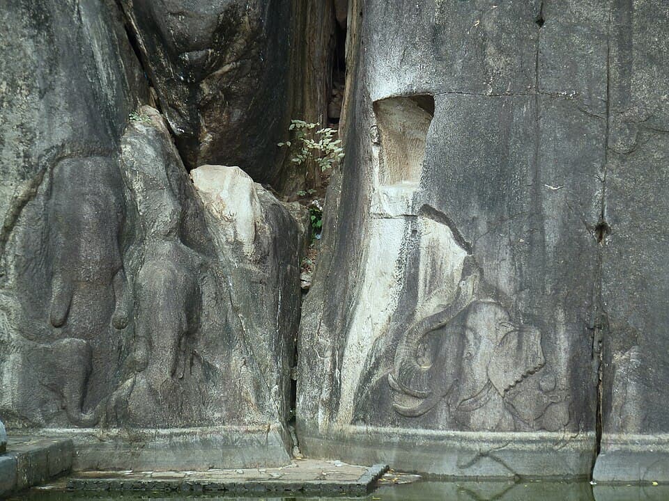 Man and horse head carving at Isurumuniya